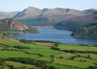 Picure of lake mountains and fields in the Lake District of England